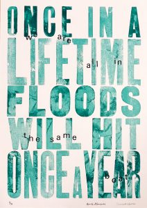 A Letterpress print by Scarlett Butler & Aimée Merriman reading 'Once-in-a-lifetime floods will hit once a year, we are all in the same boat'