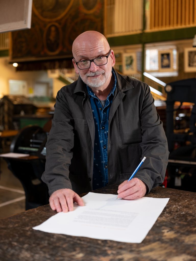 Roddy Doyle signing his short story at the National Print Museum