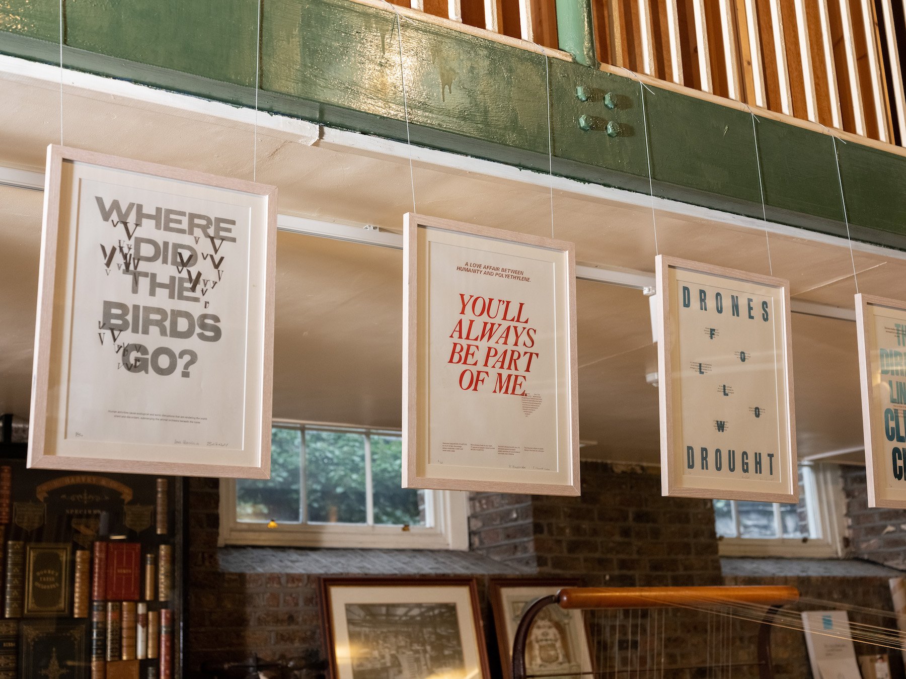 An image of a few prints from the exhibition 'Exploring the Anthropocene: A Letterpress Investigation' hung in frames at the Museum