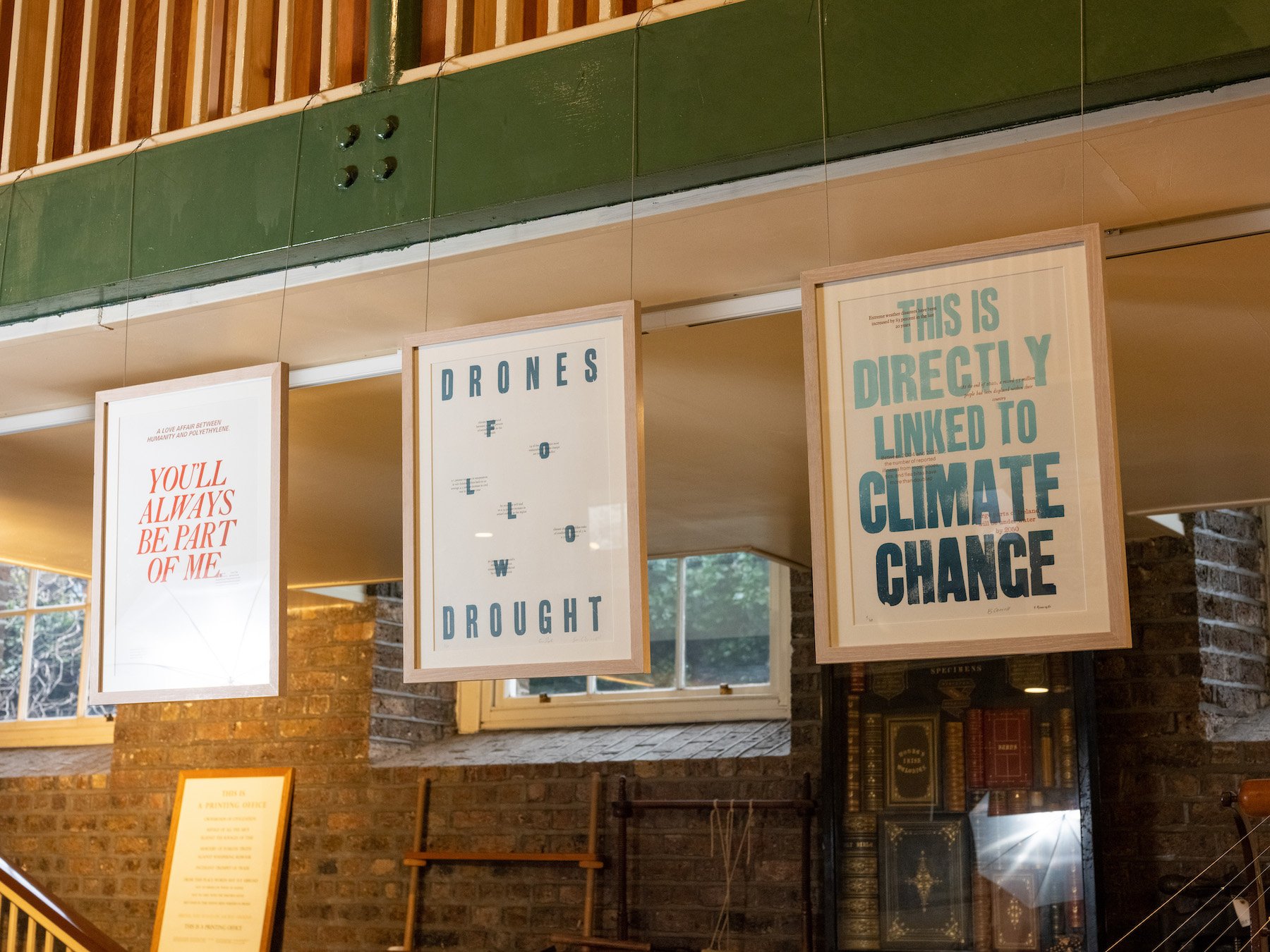An image of 3 prints from the exhibition 'Exploring the Anthropocene: A Letterpress Investigation' hung in frames at the Museum