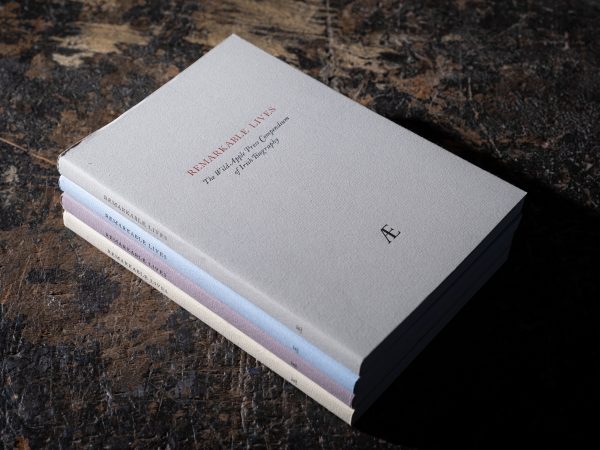 4 copies stacked together of the book 'Remarkable Lives'