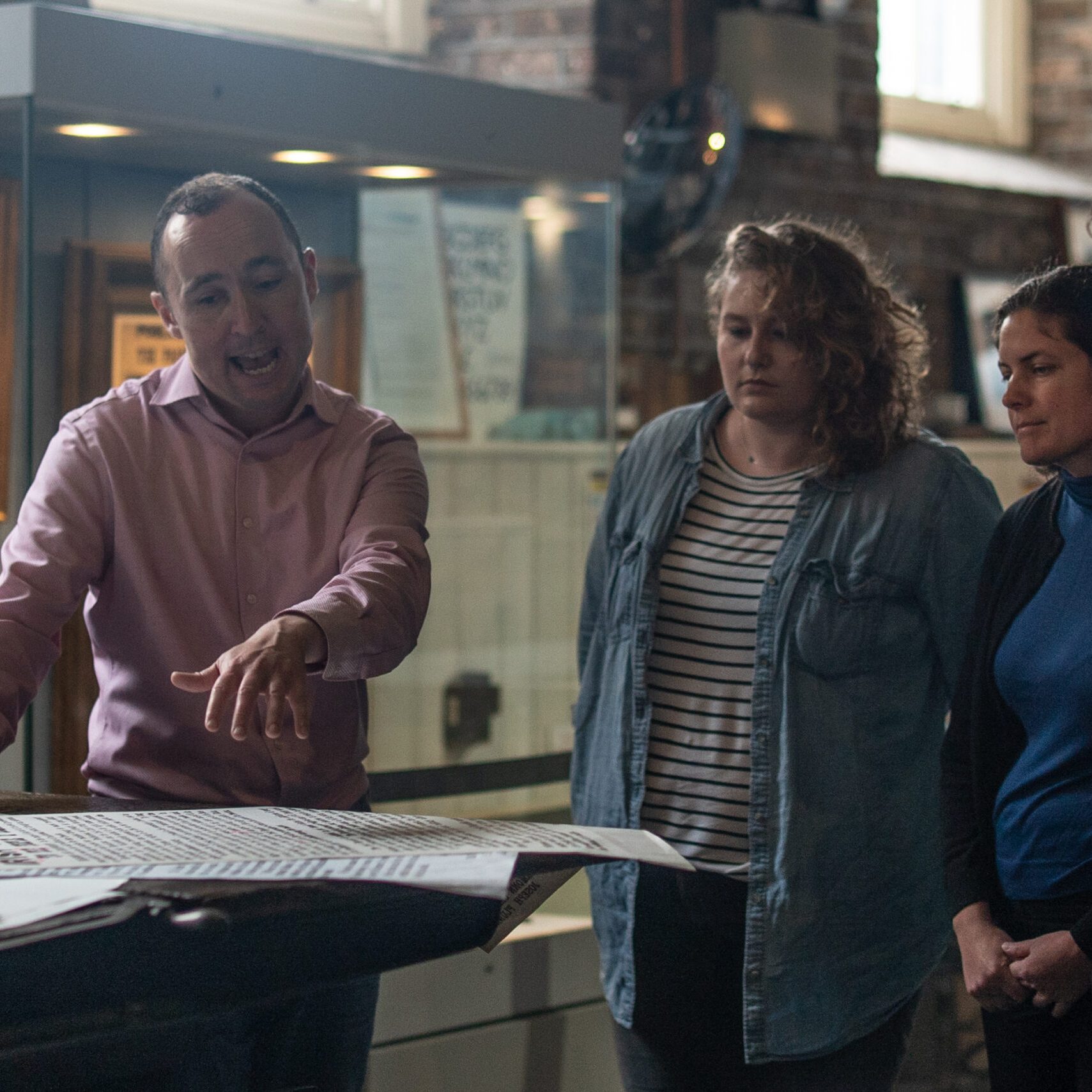 A tour guide shows the Proclamation to a tour group