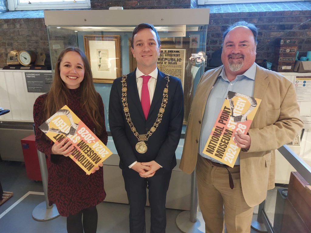 Abby Westover, the Lord Mayor of Dublin, and Pat Kerr post in front of the Proclamation, holding copies of the National Print Museum's 2024-2028 Strategy